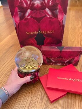 Alexander McQueen Red and Gold Decorative Snow Globe and set of envelopes .
